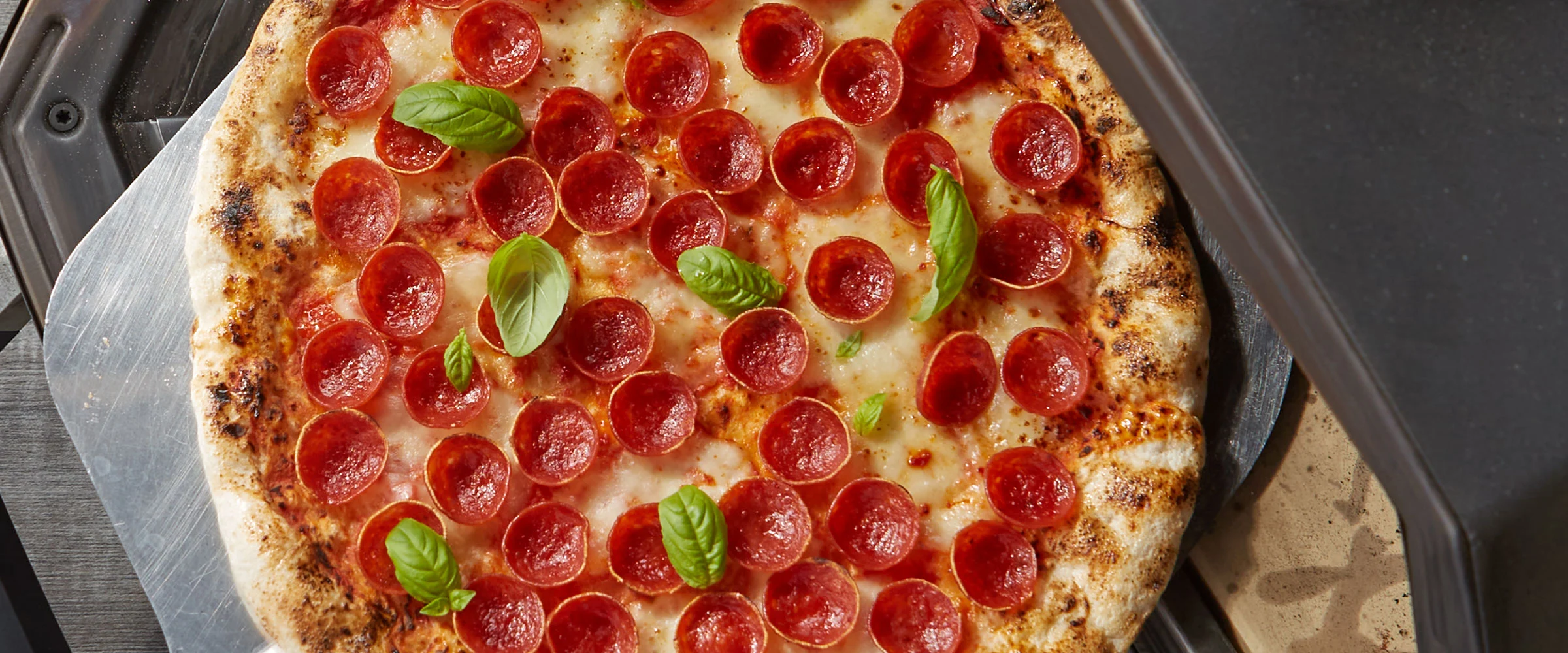 Pepperoni pizza fresh from the oven at BIG John's Pizza & Donair — pizza delivery in Calgary